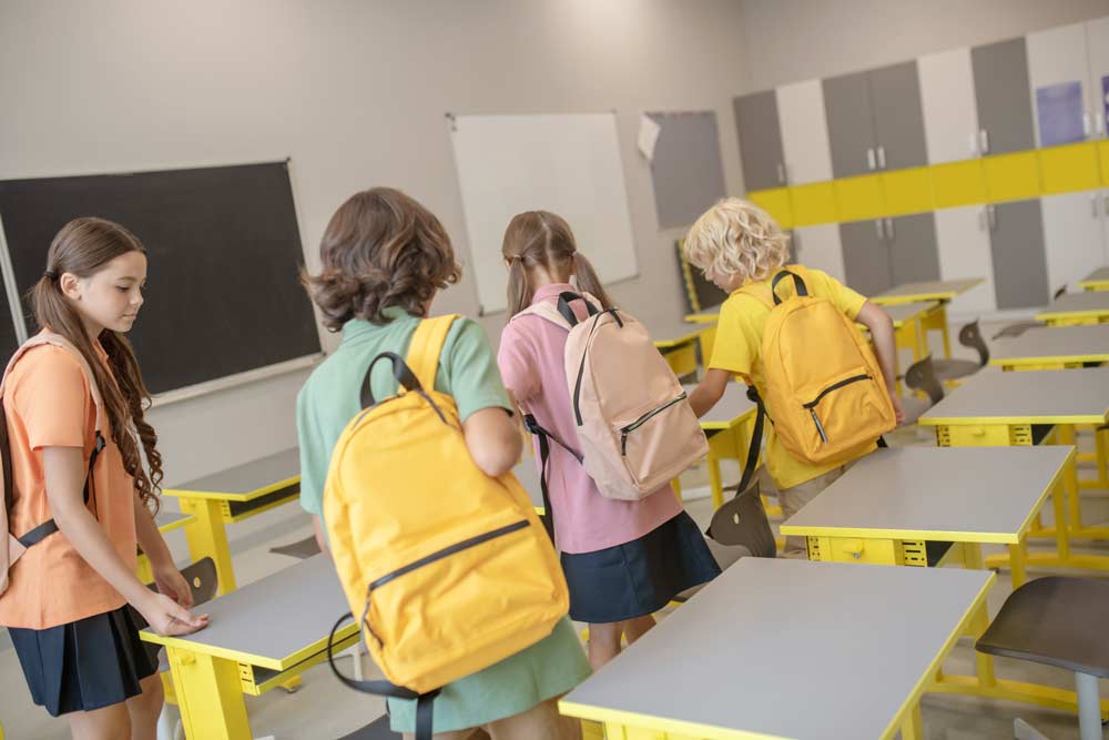 students entering empty classroom